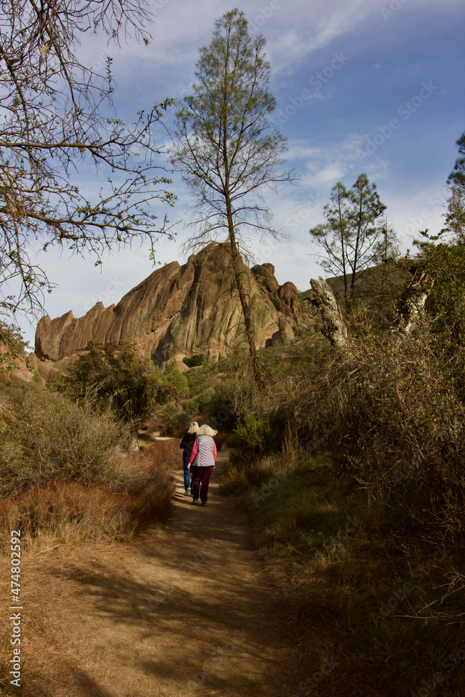 2 senior women walk together at pinnacles national, monterey county, california, u.s.a. 