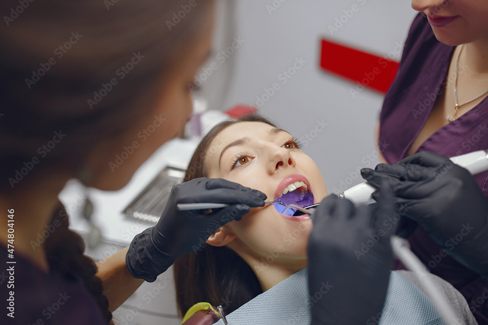 Beautiful girl sitting in the dentist's office Beautiful girl sitting in the dentist's office