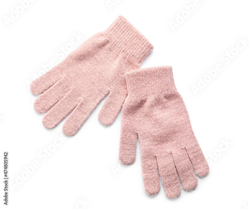 Pink warm gloves on white background