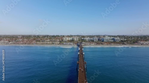 Wallpaper Mural people walk along huge wooden pier of Oceanside beach town, in San Diego county, CA. aerial Torontodigital.ca