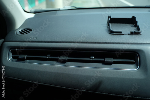 The ventilation of cold or low temperature air in a car air conditioner is located on dashboard.