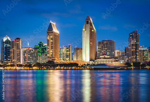San Diego California skyline at night with reflections in water. photo