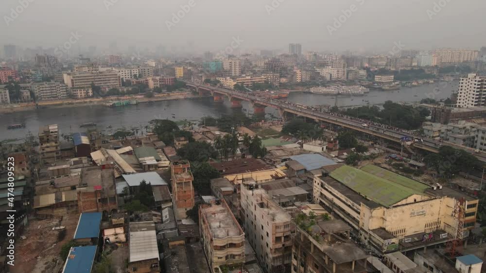 Low aerial pull out over the slums and poverty stricken areas of Old Dhaka near the Burigana River in Bangladesh Low aerial pull out over the slums and poverty stricken areas of Old Dhaka near the Burigana River in Bangladesh
