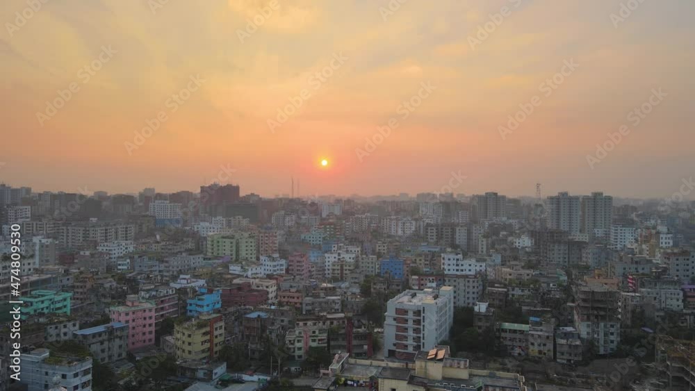 Cinematic aerial over the Khilgaon Suburb of Dhaka in Bangladesh at sunset. Cinematic aerial over the Khilgaon Suburb of Dhaka in Bangladesh at sunset.