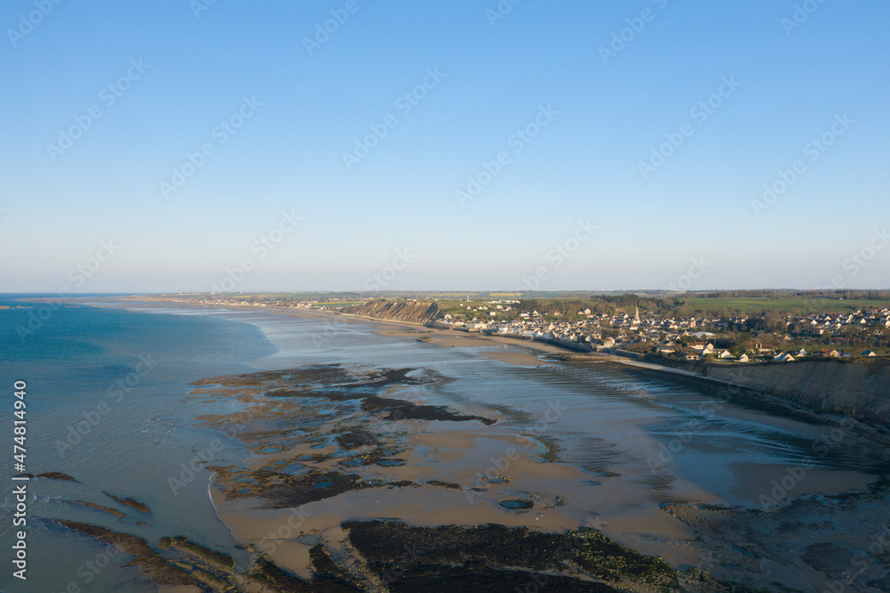 The town of Arromanches les Bains and its artificial harbor in Europe, France, Normandy, in summer, on a sunny day.