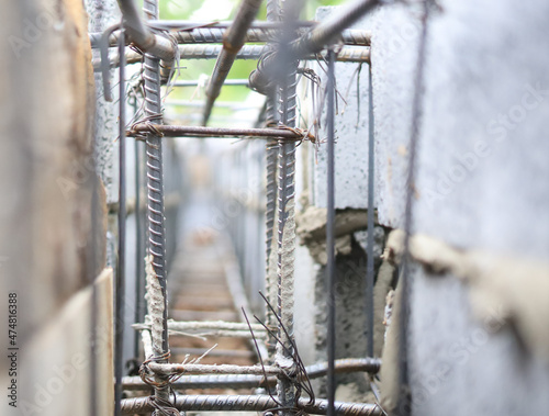 Deformed steel structures are tied together with steel wires before concrete is poured into the foundation of the building.