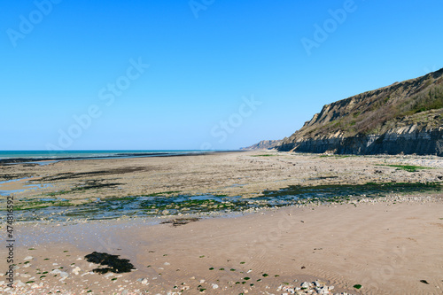 The town of Port en Bessin and its sandy beach in Europe, France, Normandy, towards Omaha beach, in spring, on a sunny day.