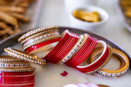 Indian pre wedding ceremony choora chura hands and bangles close up photo