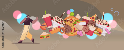 woman showing no stop gesture to junk food assortment of fast food unhealthy nutrition junkfood addiction