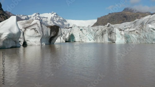 Drone view of the famous lake Breidamerkurjokull with its icebergs and ice floes in Iceland. Birds eye of icebergs of Icelandic Jokulsarlon lake in Vatnajokull National Park. Environment landscape photo