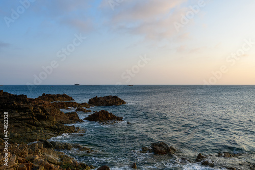 The Channel Sea and eroded rocks in Europe, France, Normandy, Manche, in spring, on a sunny day.