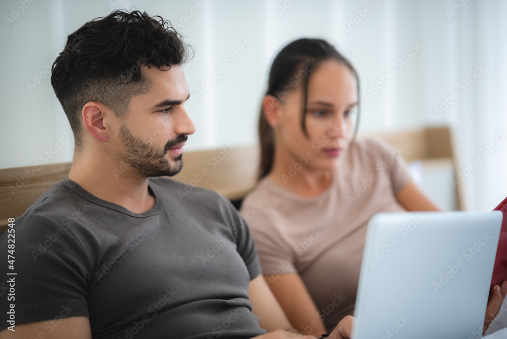 man and woman couple person are working together with laptop from home man and woman couple person are working together with laptop from home