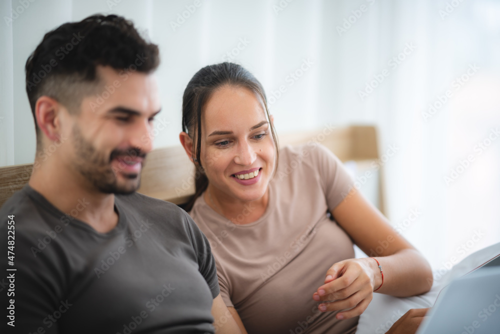 man and woman couple person are working together with laptop from home
