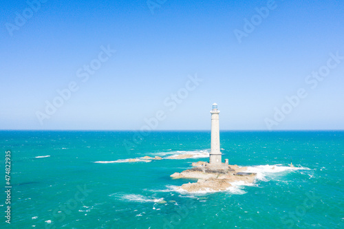 The Lighthouse of Cap de la Hague in the Channel Sea in Europe, France, Normandy, Manche, in spring on a sunny day.