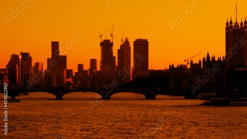 Stunning view of the Houses of Parliament, river Thames and Vauxhall in London, England, UK during sunset photo