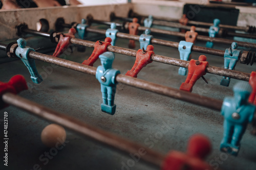 foosball. old foosball game with red and blue players. table football