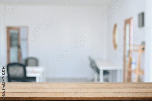 Empty wooden table with blurred background of cafe. For your product display montage.