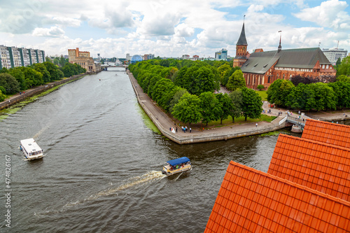 Kaliningrad, Russia, June 28, 2021. Pregolya river embankment. View of the island of Kant and Cathedral. photo