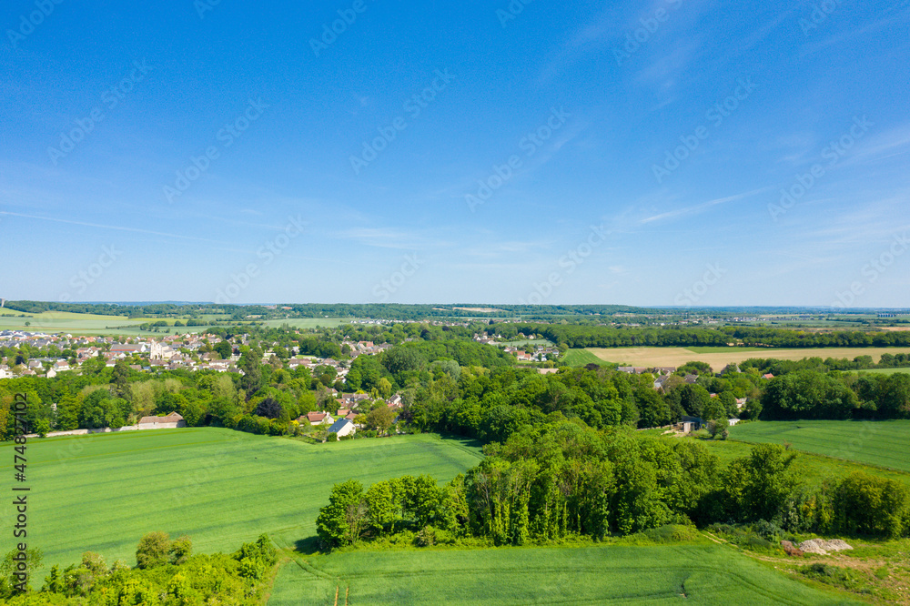 The groves around the town of Ranville in Europe, France, Normandy, towards Caen, Ranville, in summer on a sunny day.
