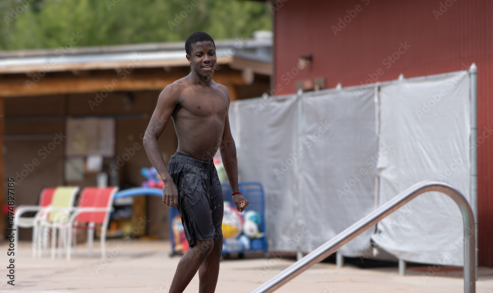 Young Colored man just out of the swimming pool. Young Colored man just out of the swimming pool.