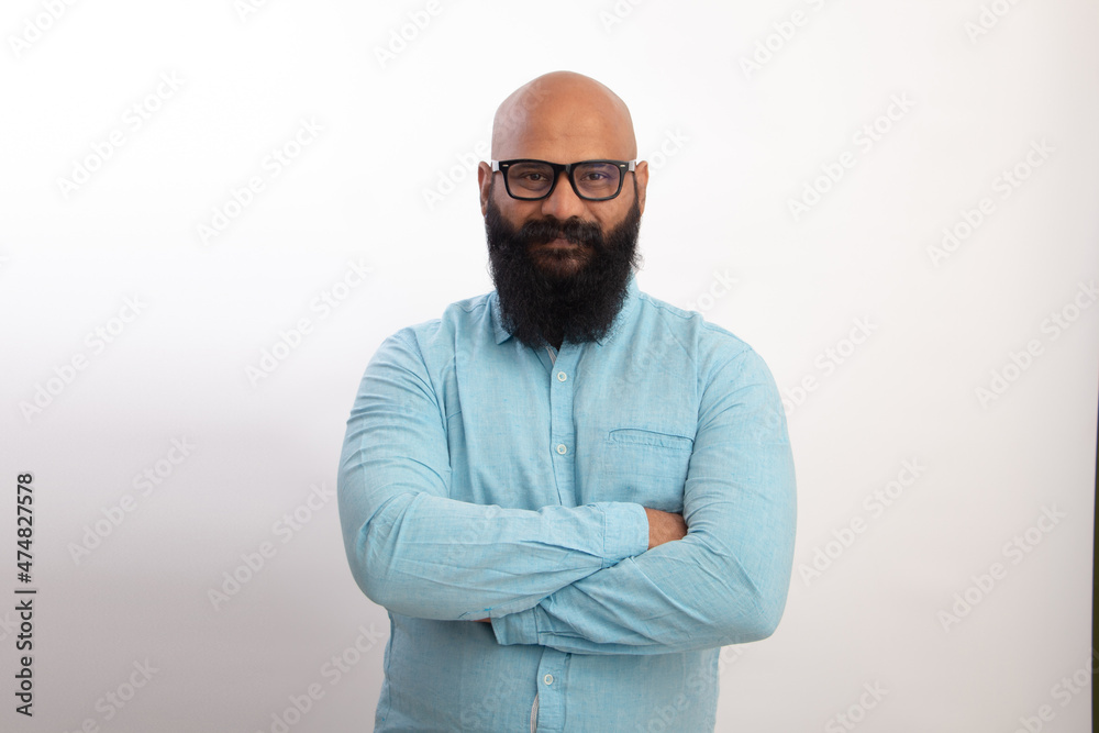 Obraz premium happy Indian Healthy middle aged man with Folding arms