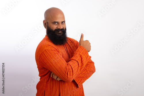 happy Indian Healthy middle aged man wearing kurta with Thumbs up gesture  photo