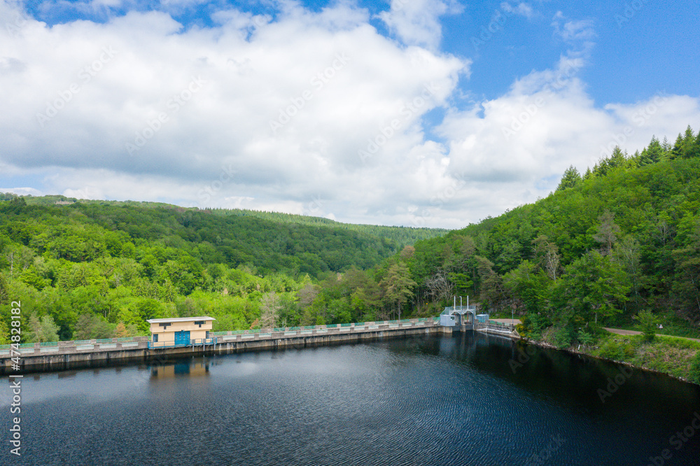 Fototapeta premium The Lac de Chaumecon dam surrounded by countryside and forests in Europe, France, Burgundy, Nievre, Morvan, in summer, on a sunny day.