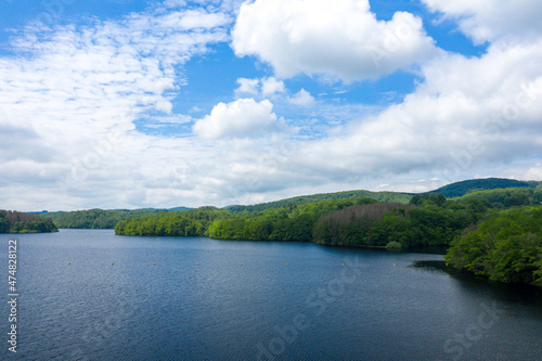 The Lac de Chaumecon surrounded by forests in Europe, France, Burgundy, Nievre, Morvan, in summer, on a sunny day.