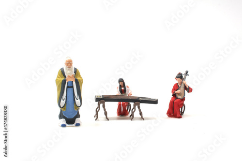 a mini figure female artist playing the Guzheng and lute photo