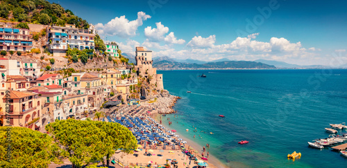 Fototapeta Naklejka Na Ścianę i Meble -  Incredible summer view of historical landmark - Torre di Cetara tower. Spectacular morning cityscape of Cetara town. Wonderful Mediterranean seascape. Vacation concept background.