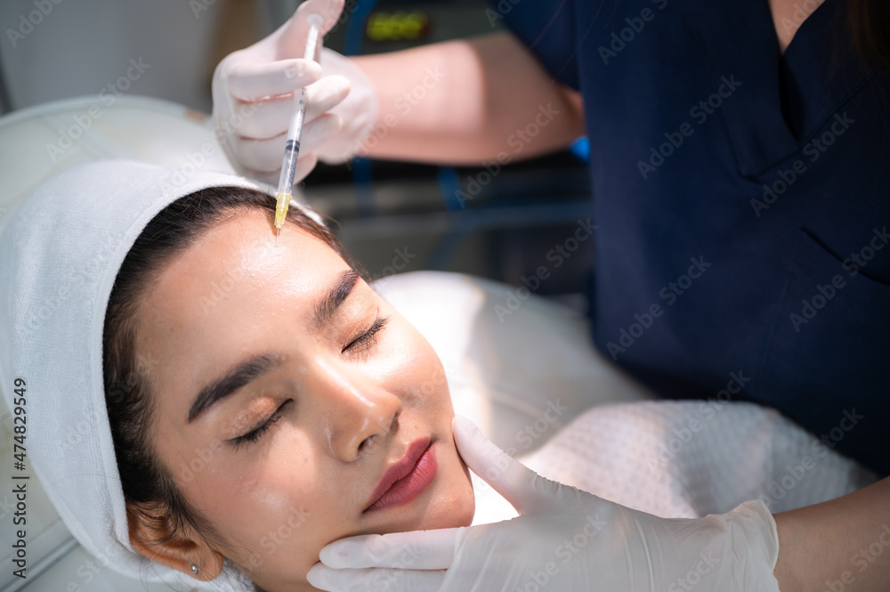 young Asian woman making cosmetology treatment skin injection, Mesotherapy of face beauty care young Asian woman making cosmetology treatment skin injection, Mesotherapy of face beauty care