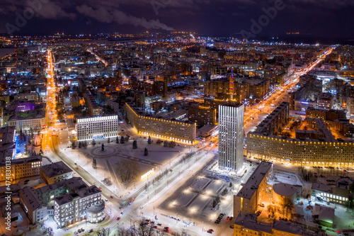 Aerial view of Lenin square with government buildings on winter night. Arkhangelsk, Russia.