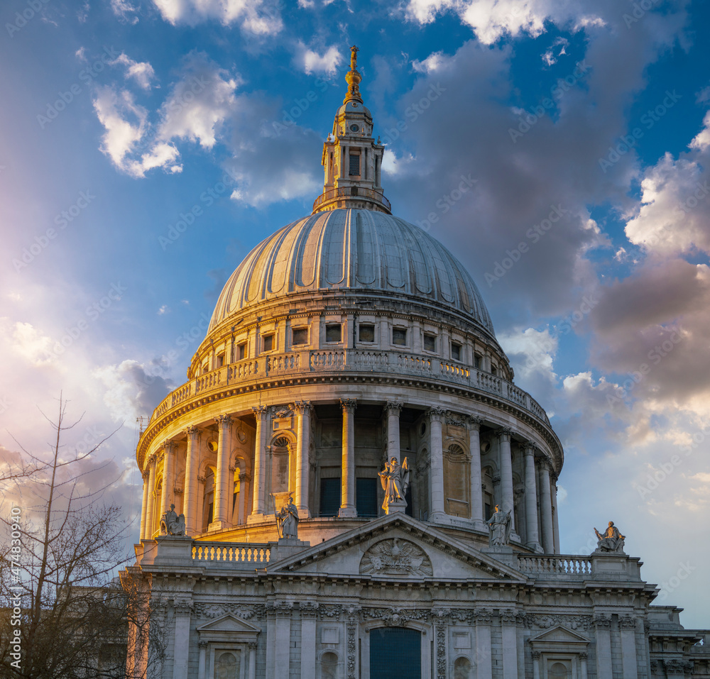 St Paul's Cathedral over evening sky clouds in London, England.