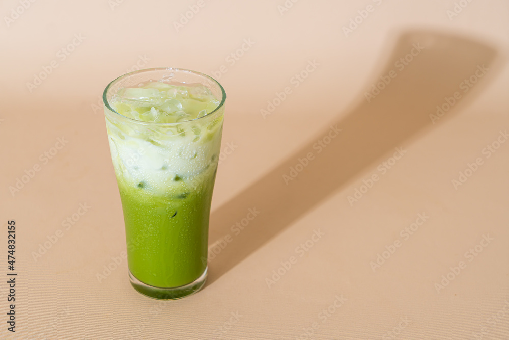 iced matcha green tea latte in glass iced matcha green tea latte in glass