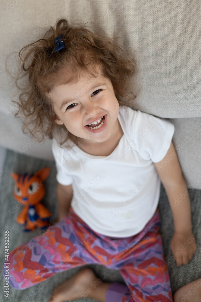 Fototapeta premium Cute little girl smiling at home