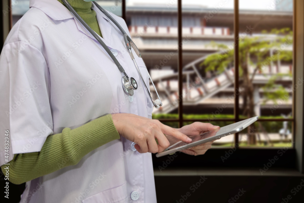 Doctor using digital tablet find information patient medical history at the hospital. Medical technology concept.