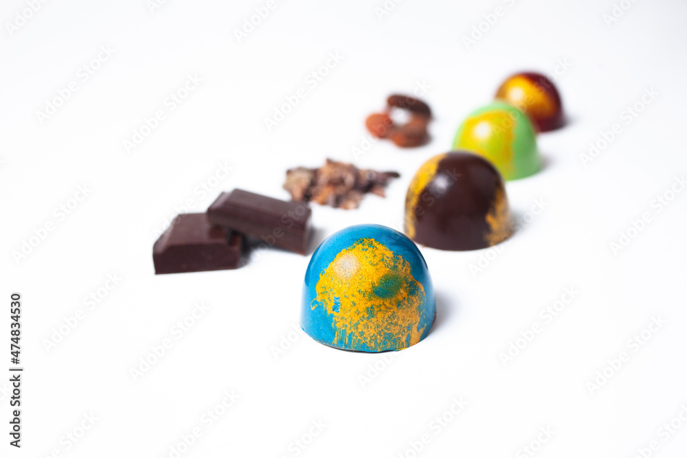 Mexican Colorful chocolate candy bonbons and ingredients on white background Mexican Colorful chocolate candy bonbons and ingredients on white background