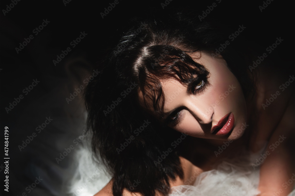 Sexy girl. Beautiful young woman portrait on black. Sensual face of elegant female model in studio. Elegant lady.
