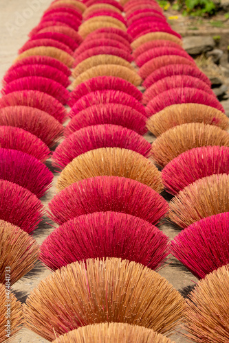 Bamboo sticks being dried outdoor to be made into incense sticks in Quang Phu Cau Village, the outskirts of Hanoi, Vietnam