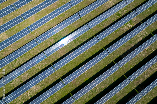 Aerial top view drone of solar panel, photovoltaic, alternative electricity source. Power farm producing clean green energy