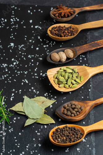 Spices selection over dark wooden table. Food or spicy cooking concept  Healthy eating Background.