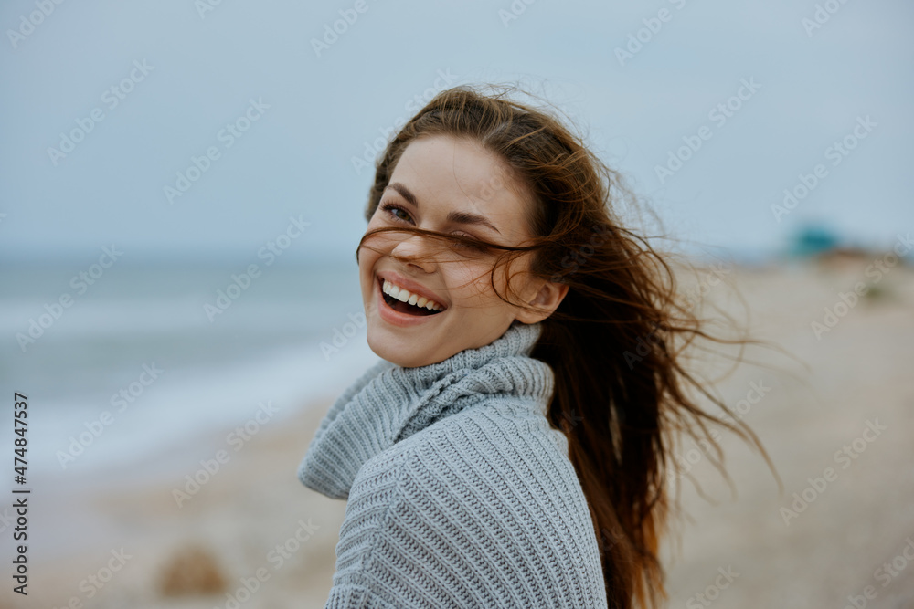 cheerful woman with long hair on the beach nature landscape walk Lifestyle