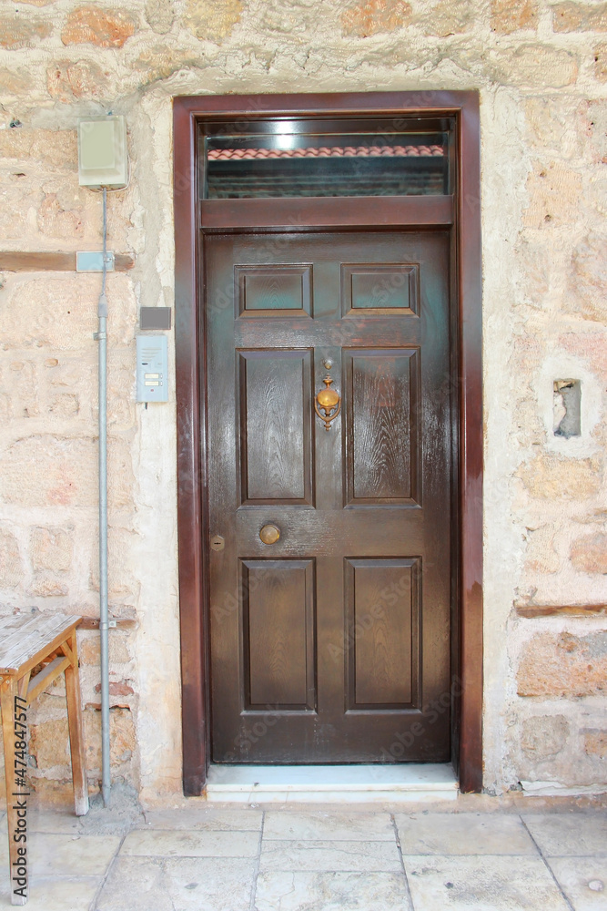 Closed wooden doors on the facade of the building