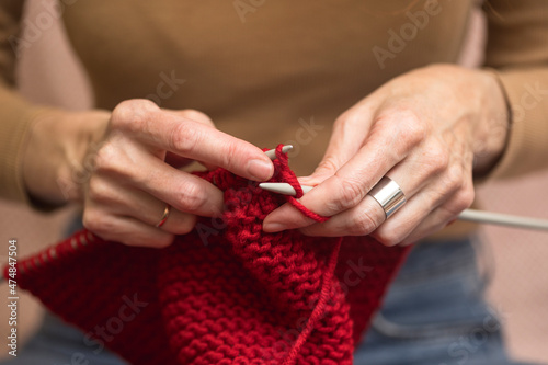 girl knits a scarf