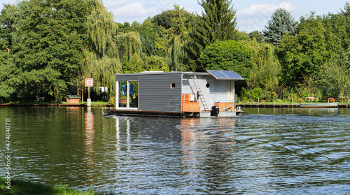 Tableau sur toile with the houseboat on the river Dahme in Brandenburg