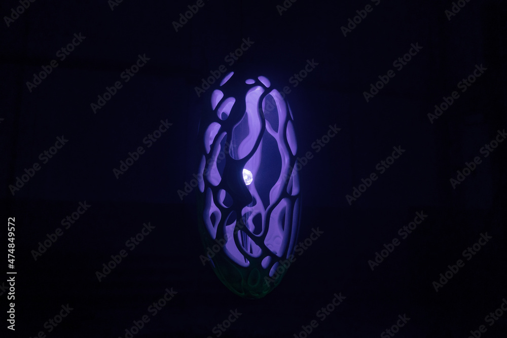 Purple abstract object in dark. Trendy color 2022.