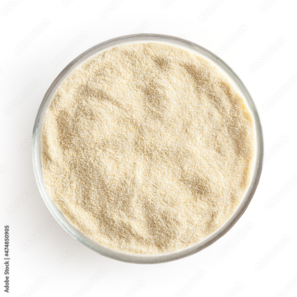 Semolina flour in glass bowl isolated on white background with clipping path Semolina flour in glass bowl isolated on white background with clipping path