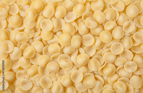 Obraz na płótnie Uncooked orecchiette pasta background w salonie