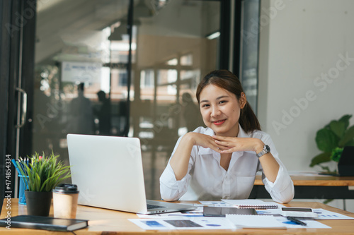Asian woman working laptop. Business woman busy working on laptop computer at office.