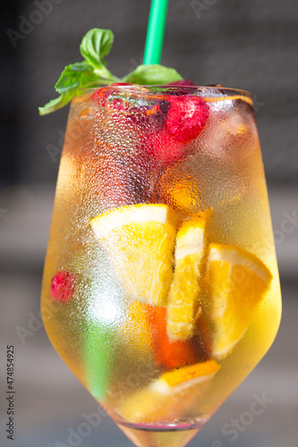 Cold and fresh white sangria in tall wine glass 